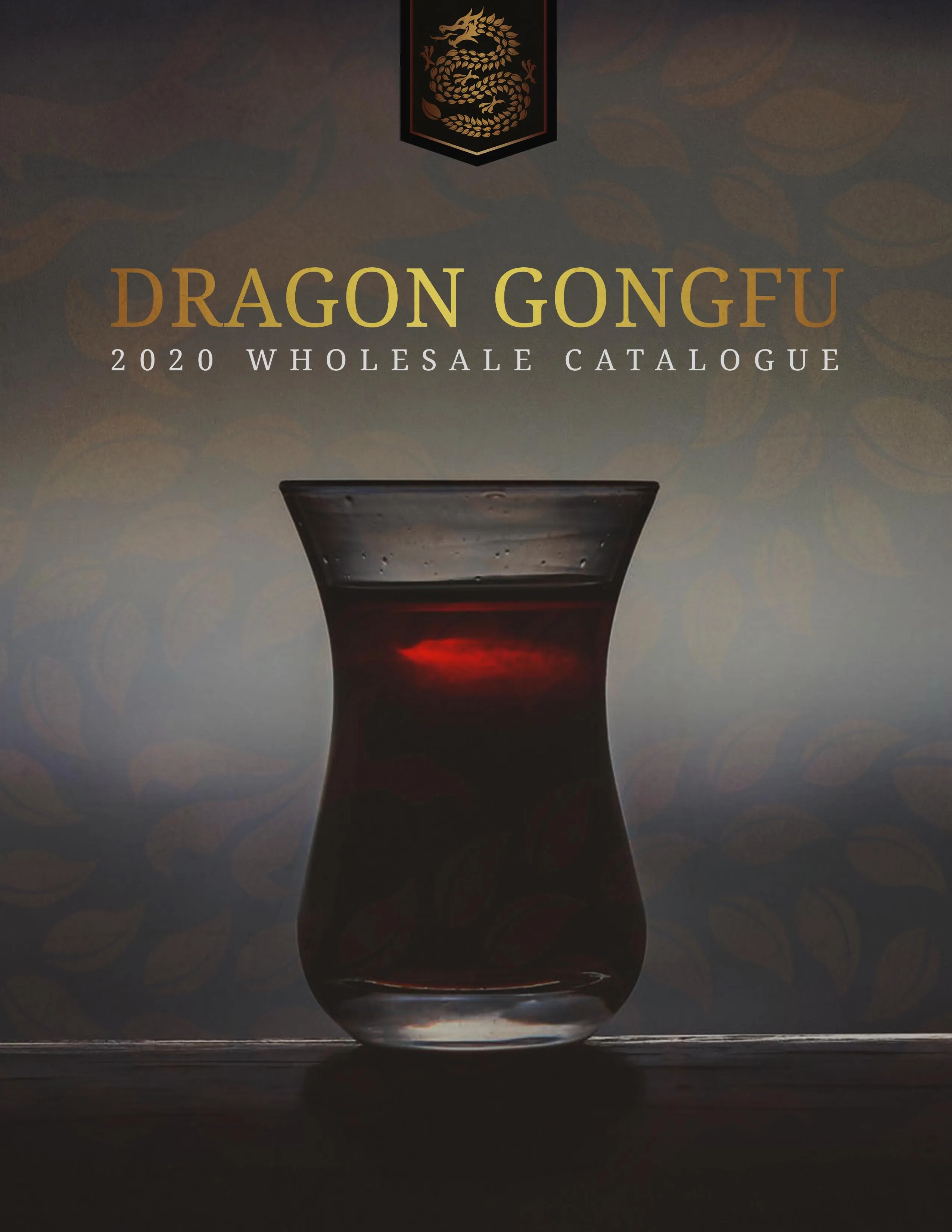 The 2020 wholesale catalogue cover: a glass of brewed Puer lit against black