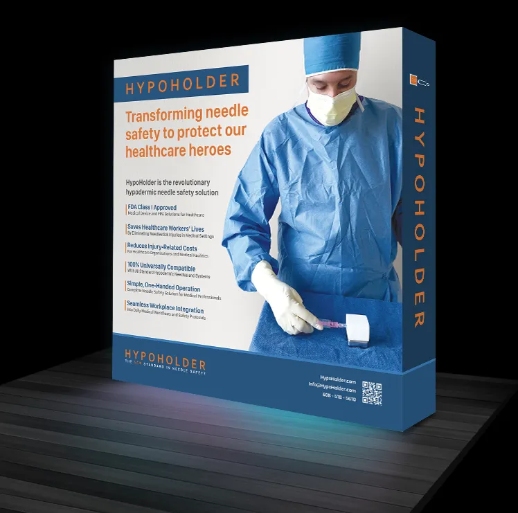 The HypoHolder trade-show back wall: a clinician using the device beside the headline Transforming needle safety to protect our healthcare heroes