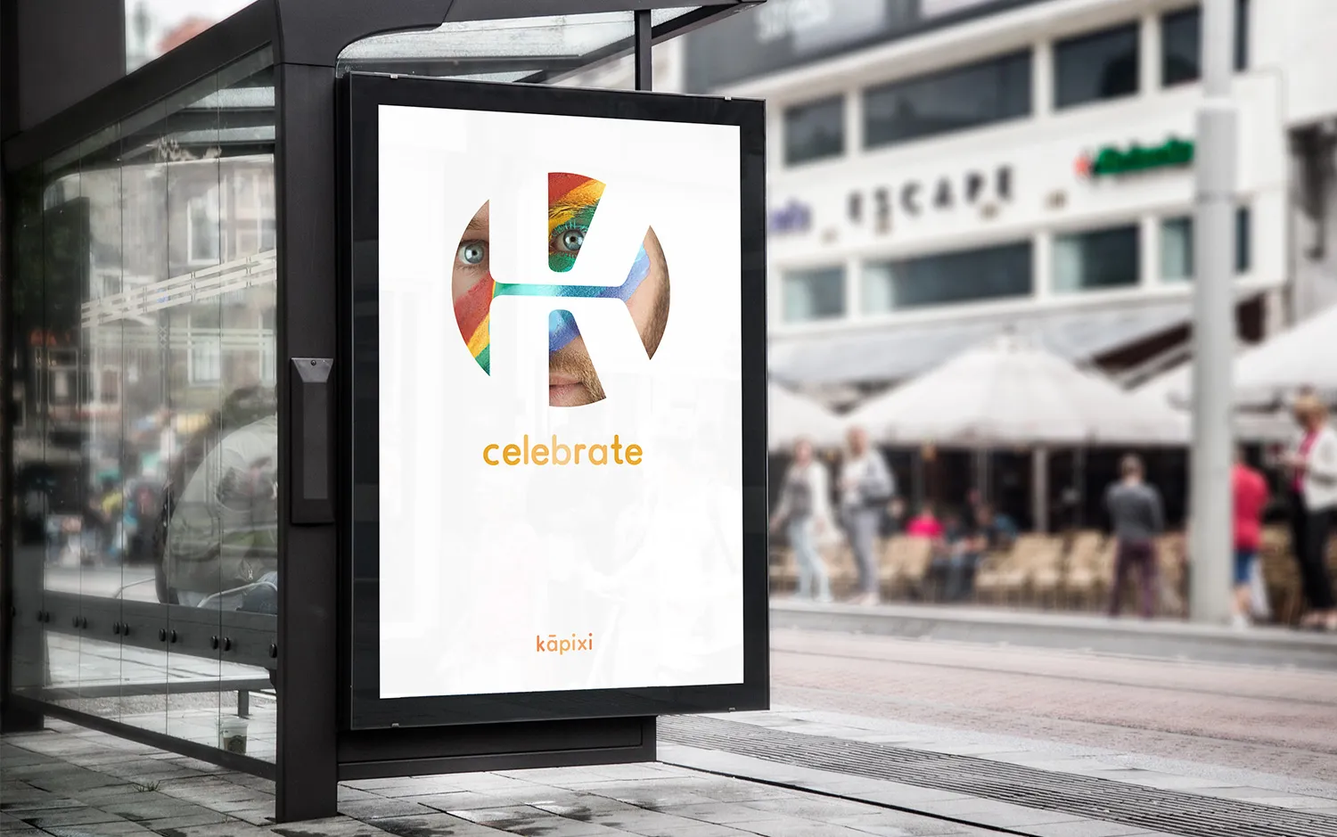 A bus-shelter poster carrying the mark filled with a painted face, on a wet city street