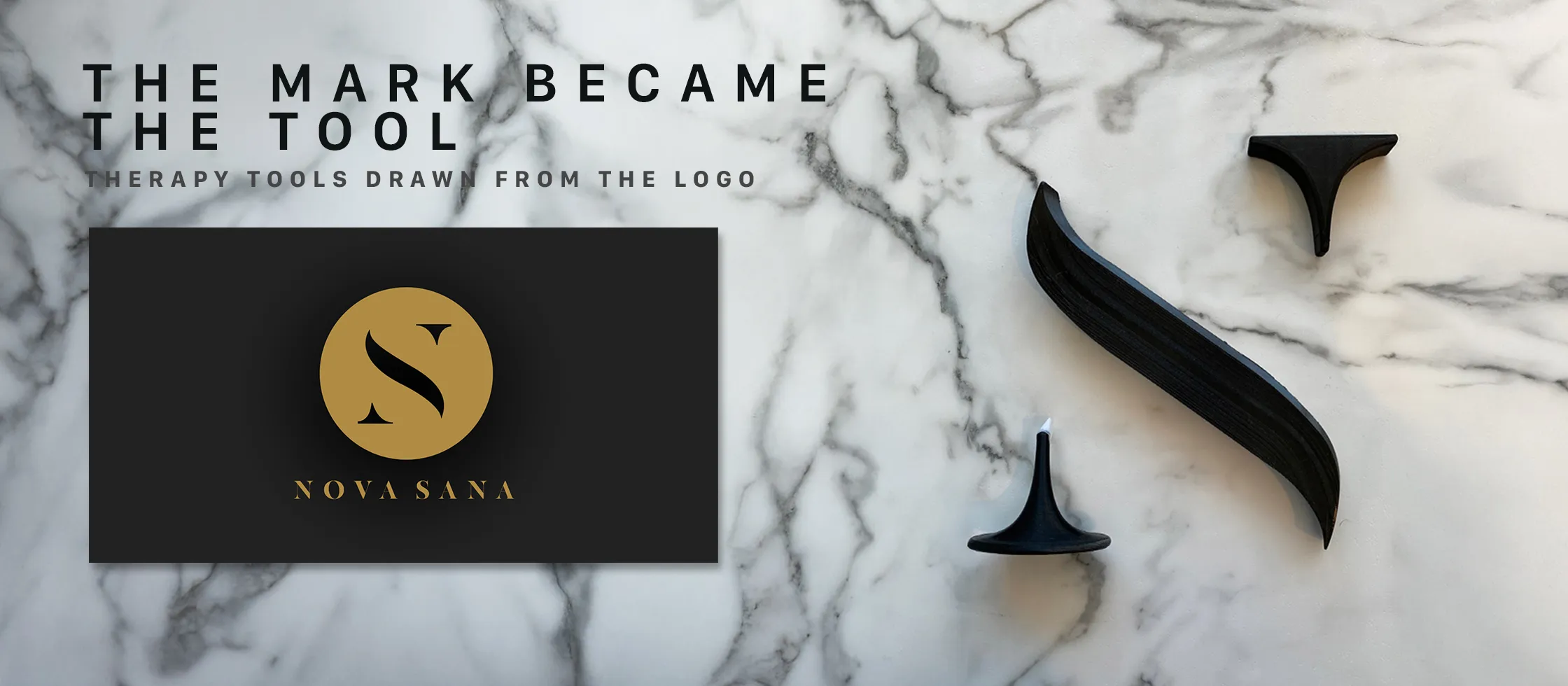 The brand card beside three black therapy tools laid on marble, their shapes drawn from the curve of the S mark
