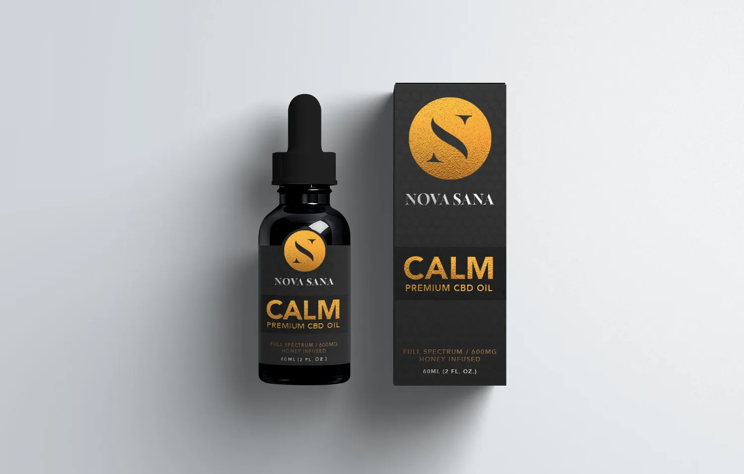 CALM: a dark dropper bottle beside its box, both carrying the gold mark and the product name