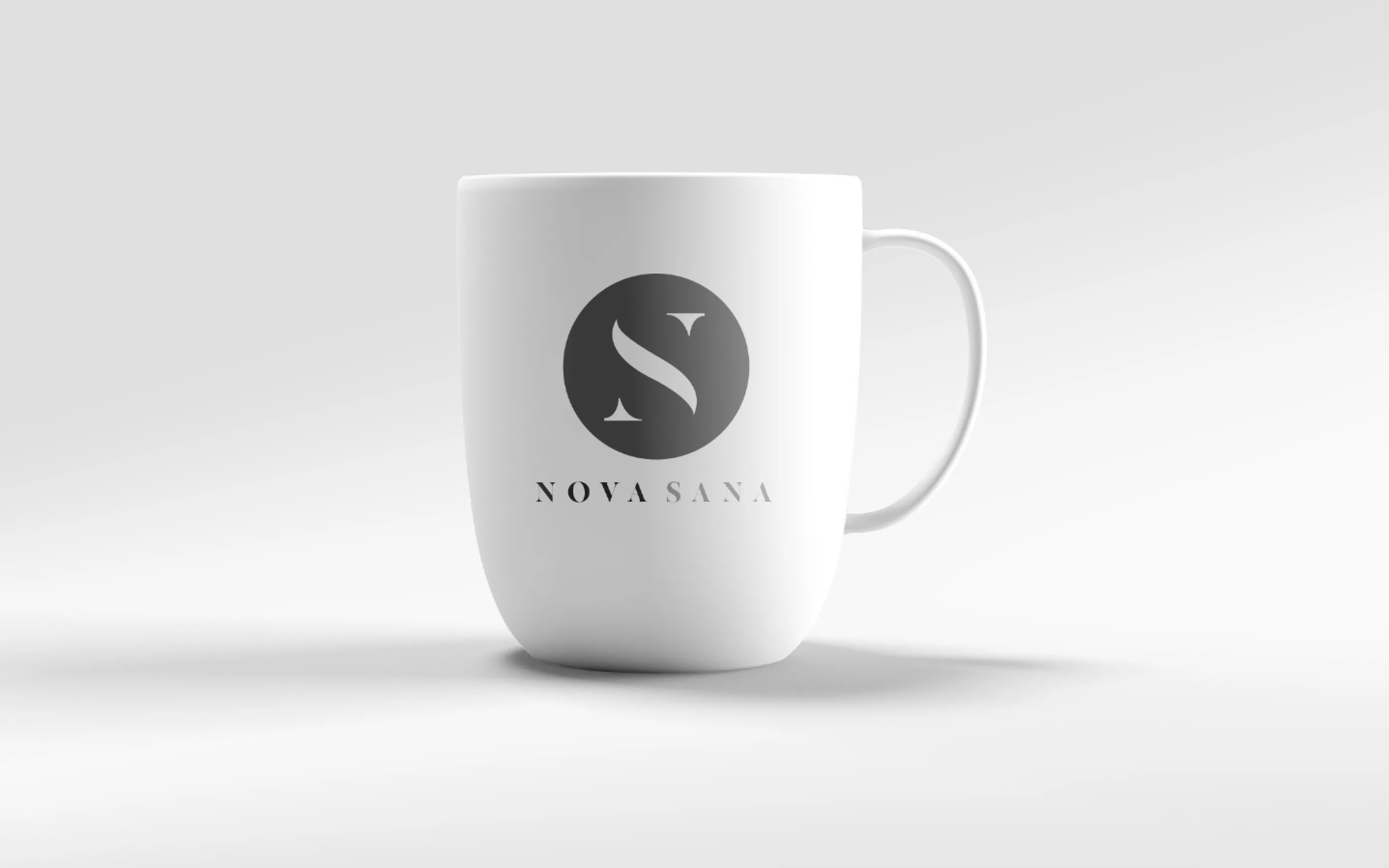 A white mug carrying the mark and the name