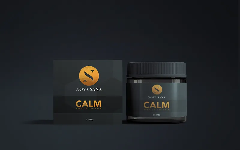 CALM balm: a jar beside its carton, in the same dark and gold system
