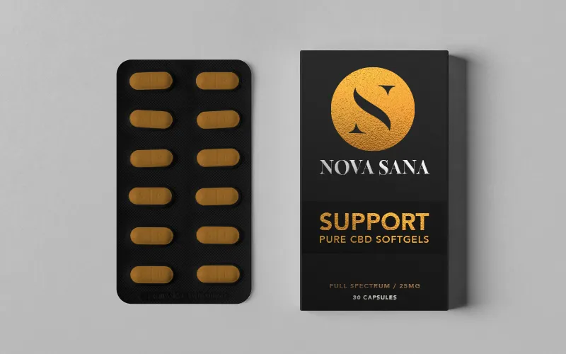 SUPPORT: a softgel blister pack beside its carton, in the same dark and gold system
