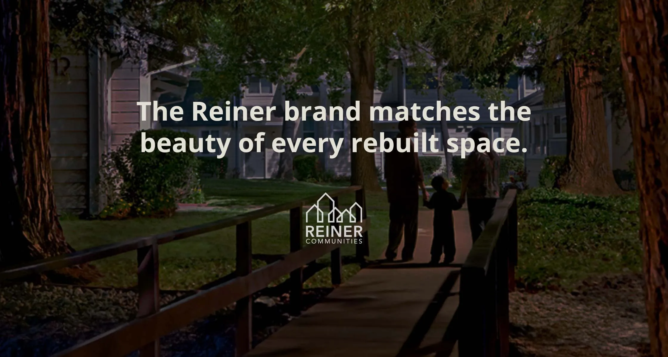 A family walking a garden path through a Reiner community at dusk, with the line "The Reiner brand matches the beauty of every rebuilt space" and the Reiner Communities logo